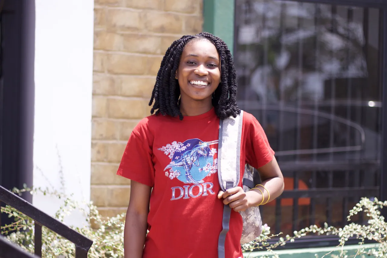 Girl in red shirt at Salone Tech Nation Campus